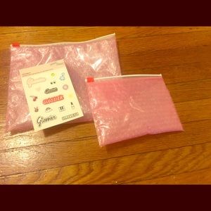 2 glossier pouches and stickers